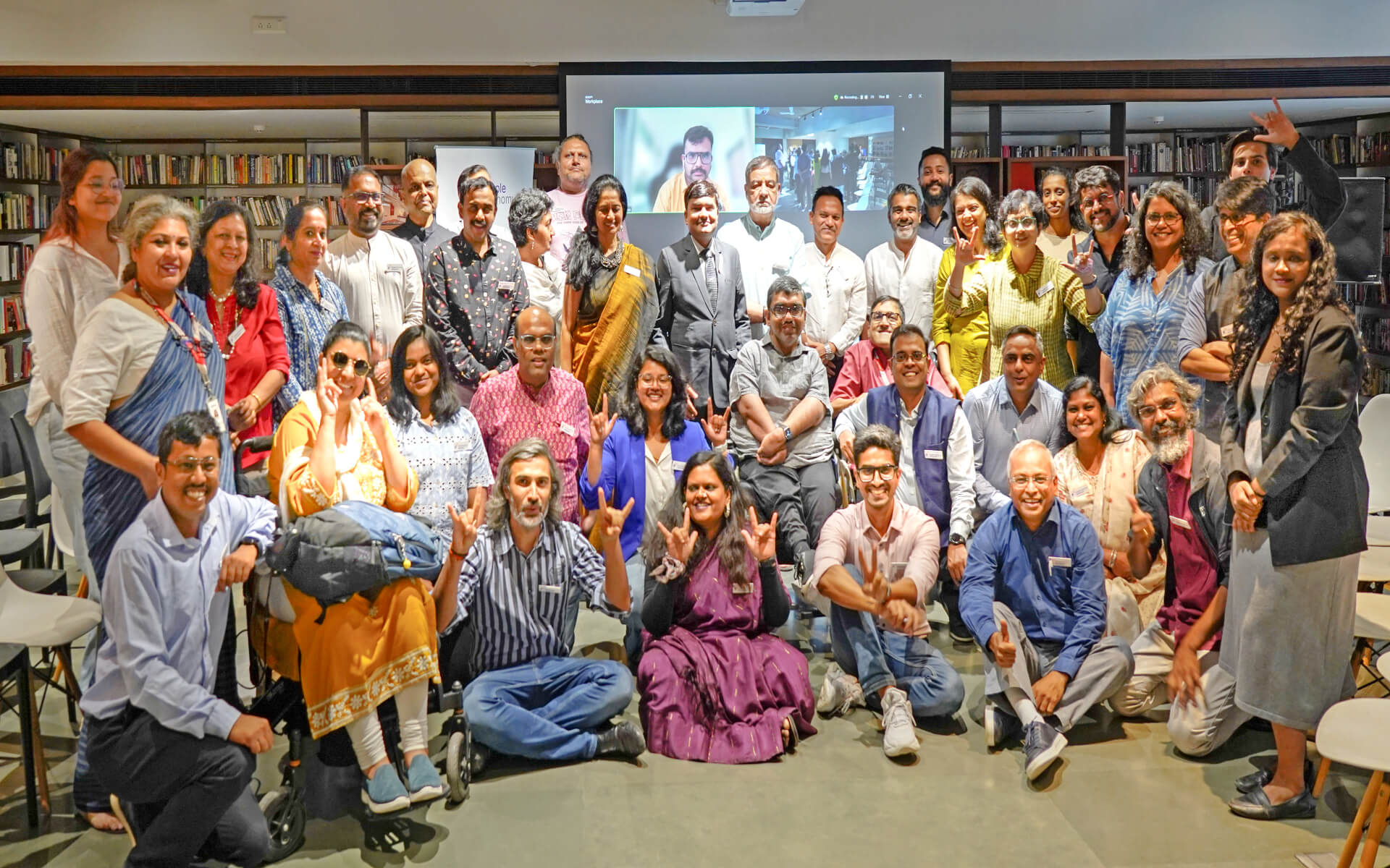 Participants at the Launch of the Purple Economy event posing for a group photo.