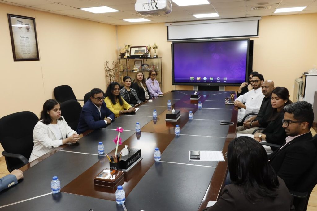 Participants attending a meeting in a conference room.