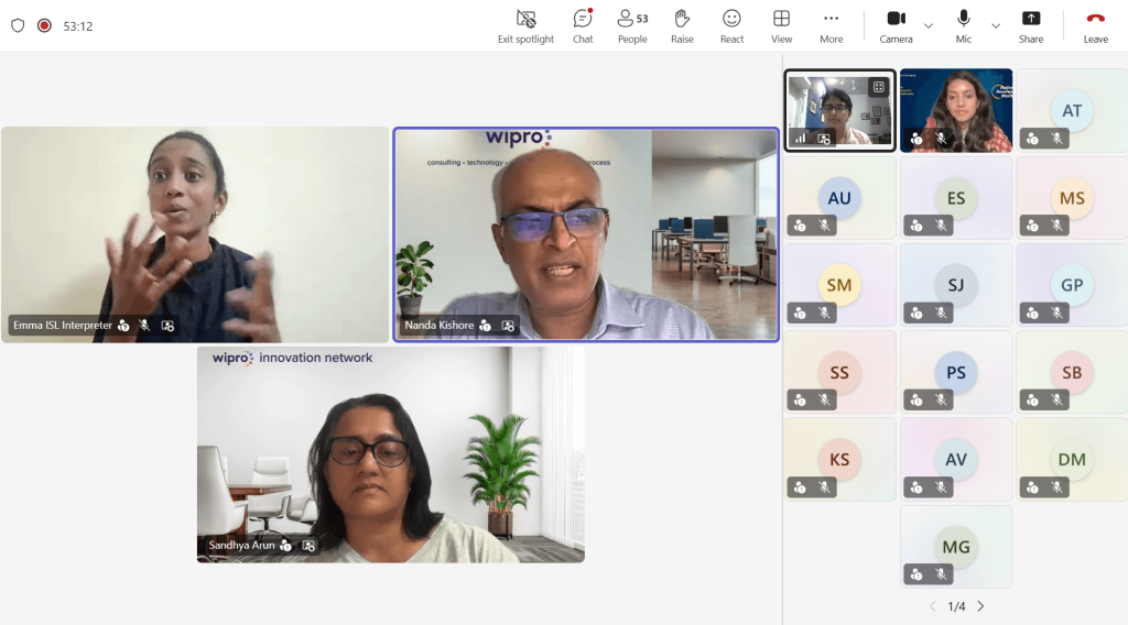 A video call showing speakers and a sign language interpreter.